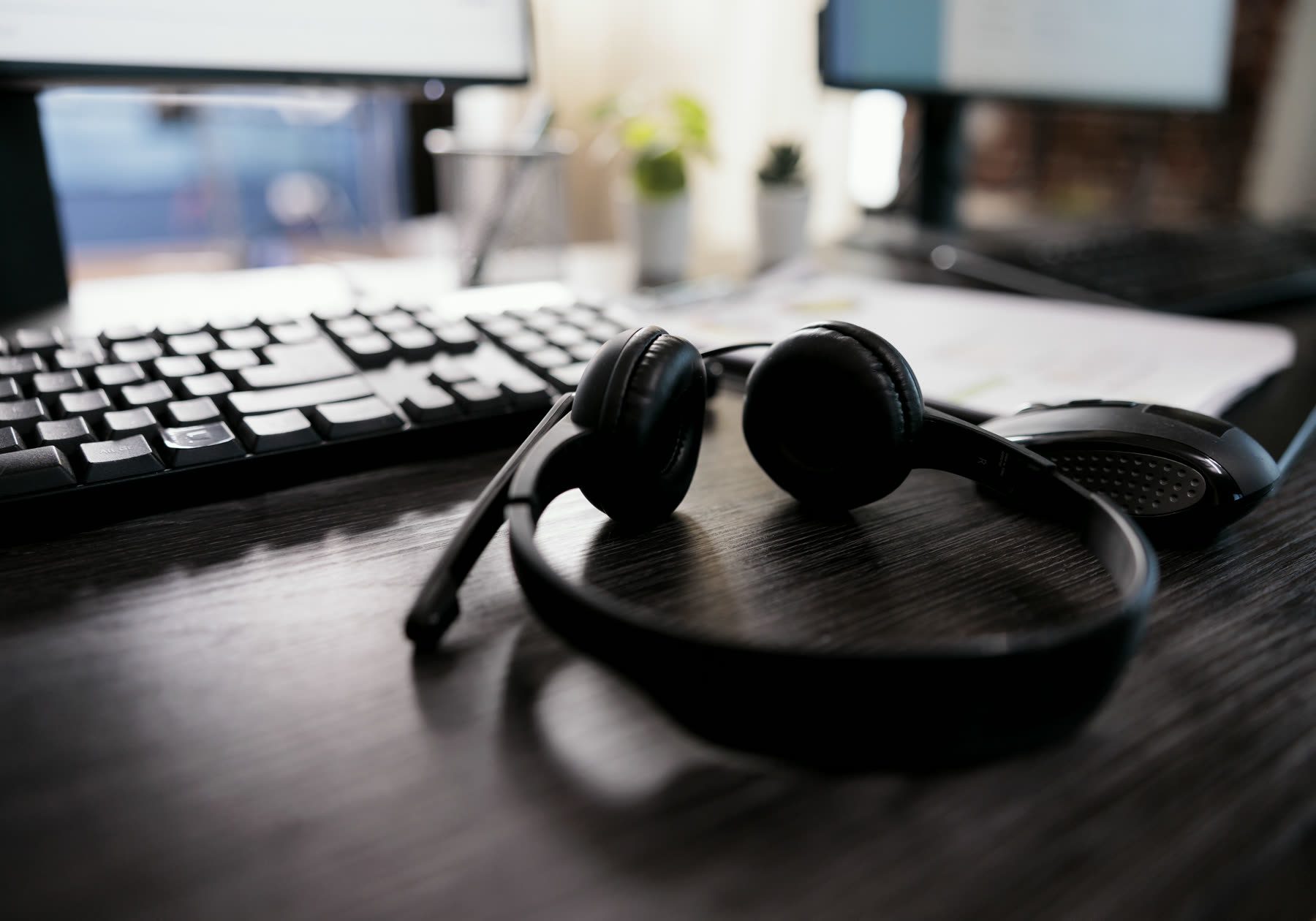 A headset on a busy desk