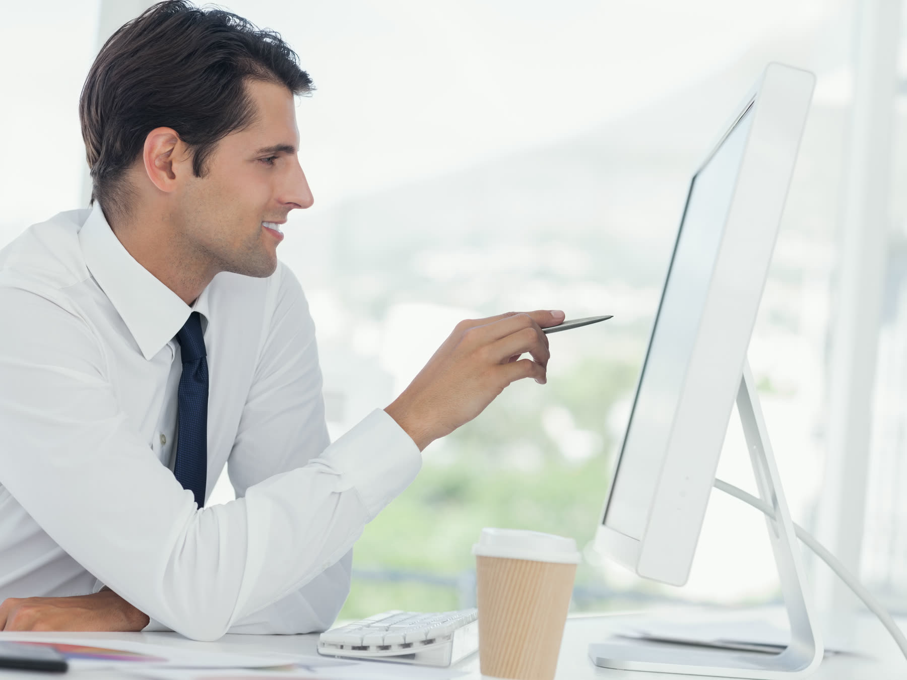 An office worker checking flagged items on screen