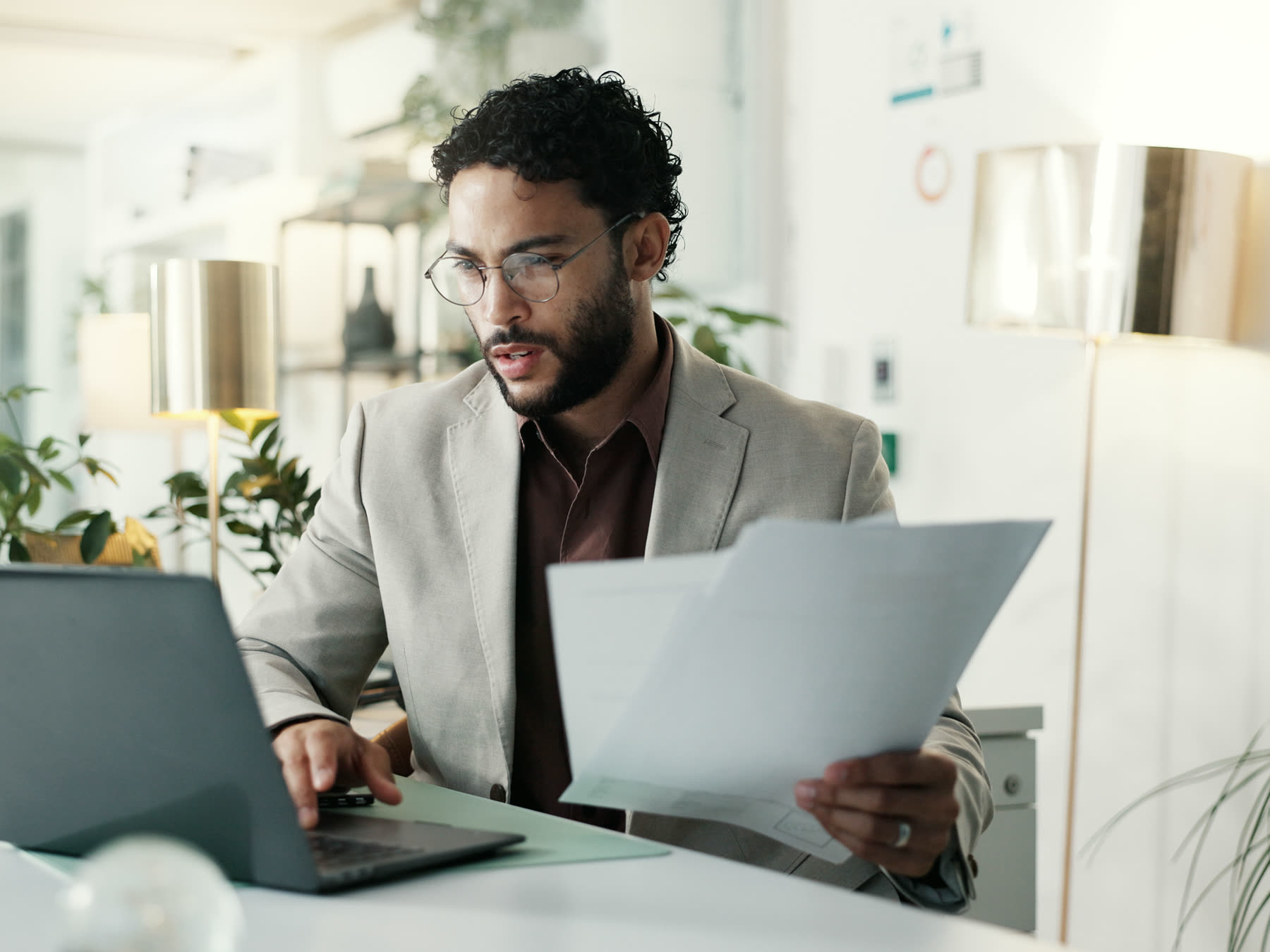 A small business owner working through admin at their premises