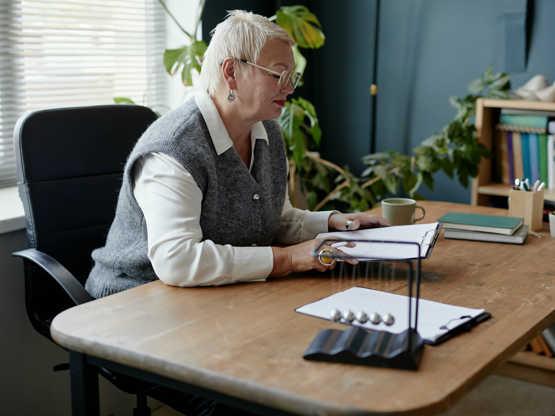 A carer sitting with a resident in a care home